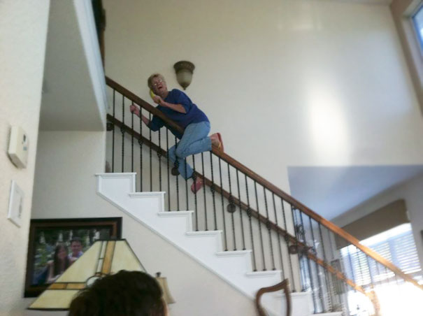 Just My 70 Year Old Grandma Sliding Down The Stair Railing Holding A Banana