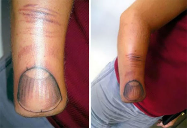 The Giant Thumb Tattoo