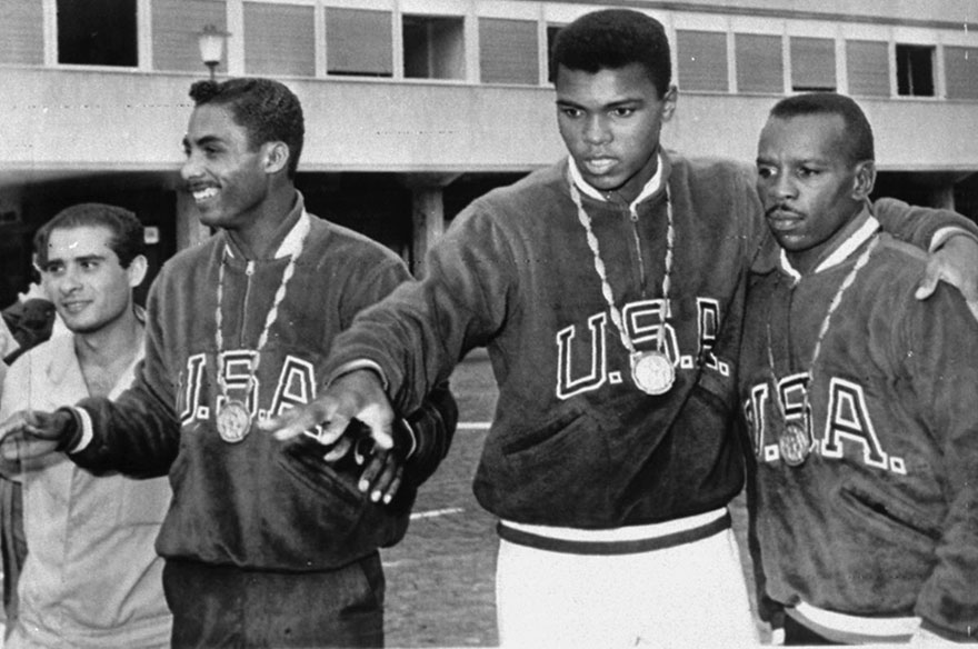 A Trio Of U.S. Boxers Wear Gold Medals At The Olympic Village In Rome, September 6, 1960. From The Left Are: Wilbert Mcclure Of Toledo, Ohio, Light Middleweight; Cassius Clay Of Louisville, Ky, Light Heavyweight; And Edward Crook Of Fort Campbell, Ky, Middleweight