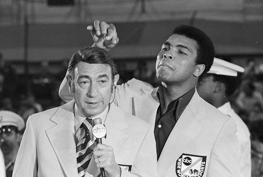 Muhammad Ali, Former World Heavyweight Boxing Champion, Toys With The Finely Combed Hair Of Television Sports Commentator Howard Cosell Before The Start Of The Olympic Boxing Trials, Aug. 7, 1972, In West Point, NY