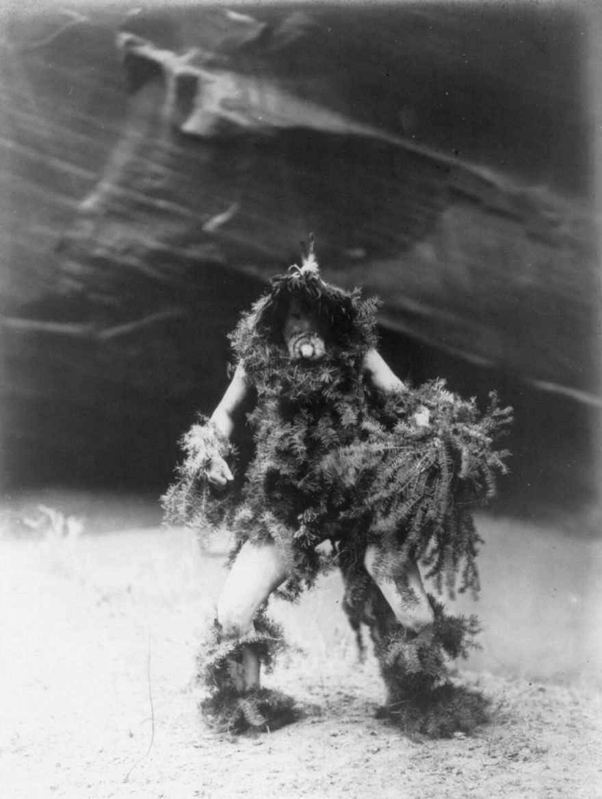 Navajo Man Bedecked In Hemlock Boughs And Mask Of A Clown Associated With The Mischievous Rain God Tonenili, 1905