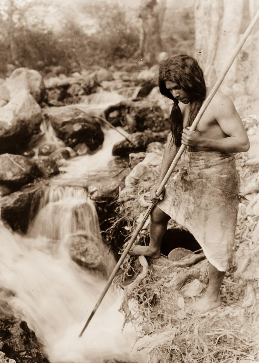 A Hupa Spear Fisherman Watches For Salmon, 1923