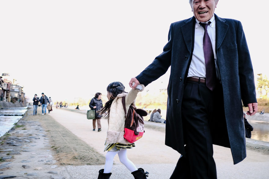 Grandfather Takes His Granddaughter Out To Play