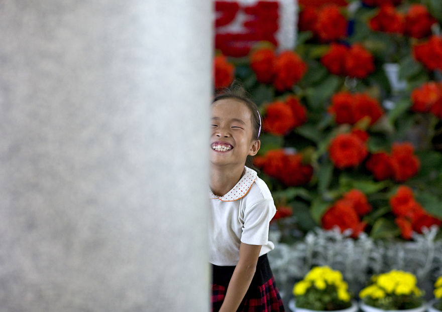 Little Girl In The International Kimilsungia And Kimjongilia Festival, Pyongyang, North Korea