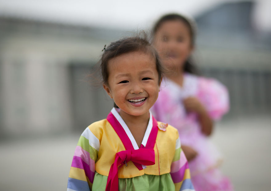 Young Girl In Traditional Dress Smiling, Pyongyang, North Korea
