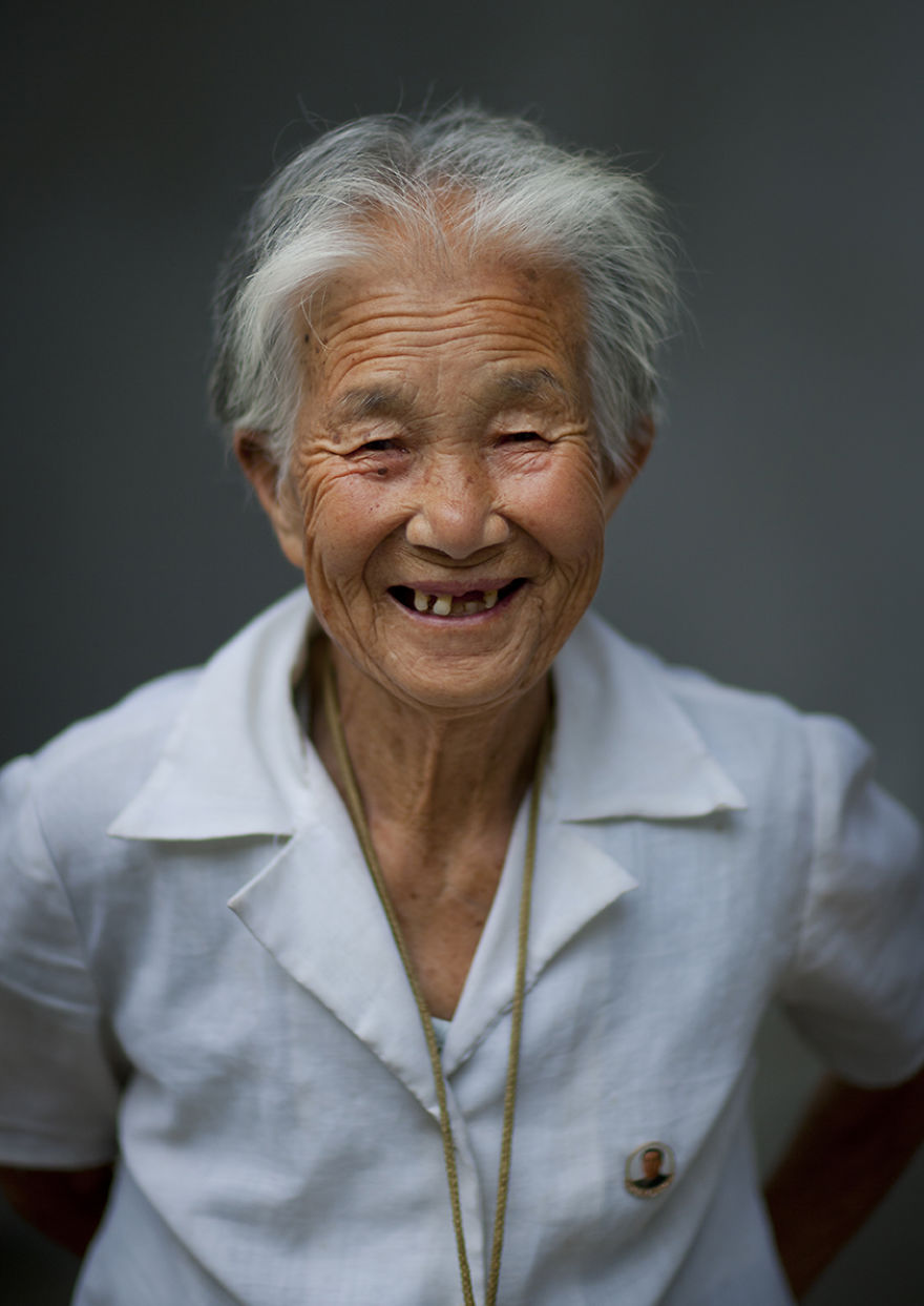 Elderly Woman Smiling With Toothless Grin, Pyongyang, North Korea