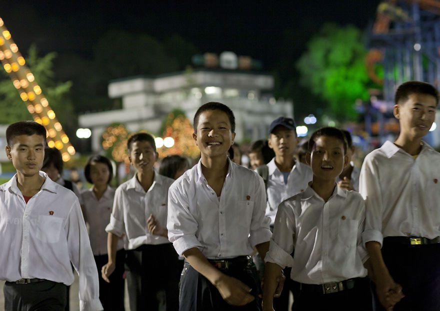 Young Men Laughing At Kaeson Youth Park Fun Fair, Pyongyang, North Korea