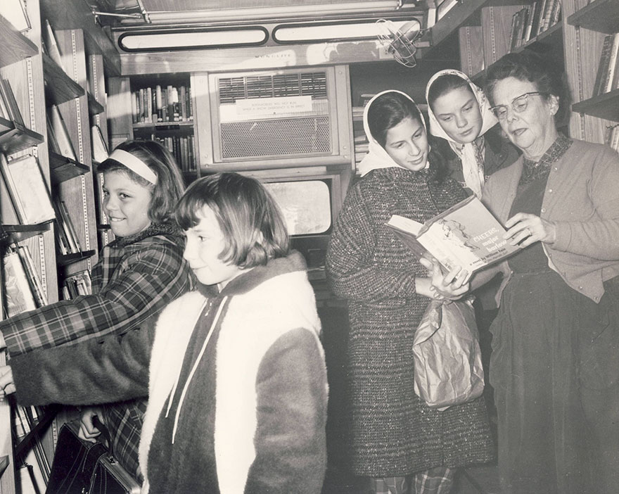 Patrons Visit The Bookmobile In 1962. Mrs James B. Wilson, Librarian, Performs Readers' Advisory Service At Far Right