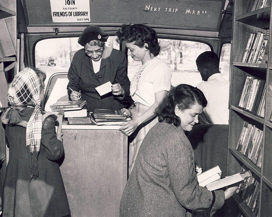 Carolyn Herntz Assists Patrons Visiting The Bookmobile, 1958