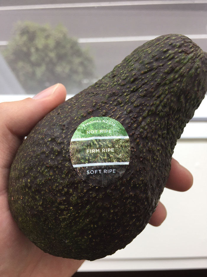 avocado with a sticker