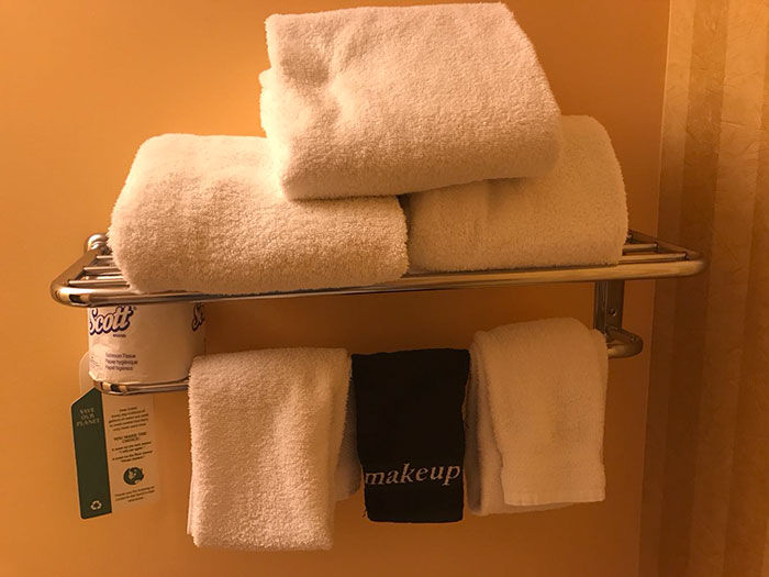 white towels and one black towel with the words 'make up'