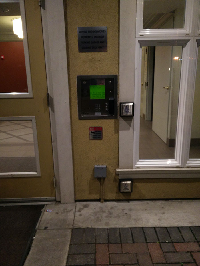 door with normal and foot height wheelchair door buttons