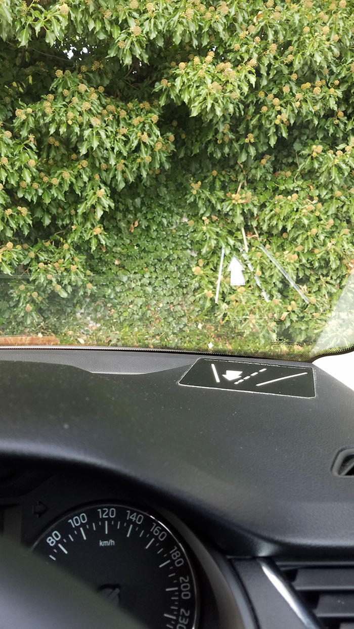 Rental Car In Ireland Has Dashboard Sticker That Reflects In The Windshield To Remind You What Side Of The Road To Drive On