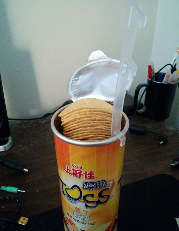 tube with chips and a tab to lift the chips in it