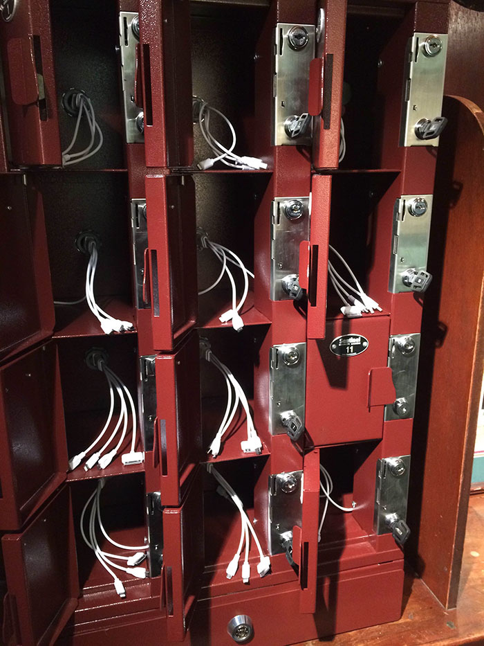 A Local Bar Has An Area Where You Can Rent A Locker To Store Your Phone While It Charges