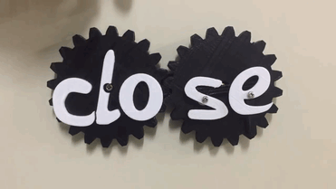 two gears spinning with open and close sign