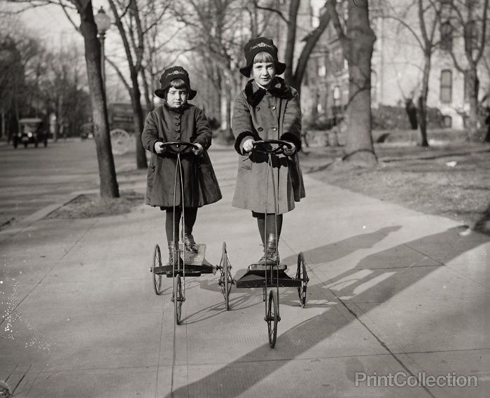 Two Girls Play With Their Tricycles, 1920s