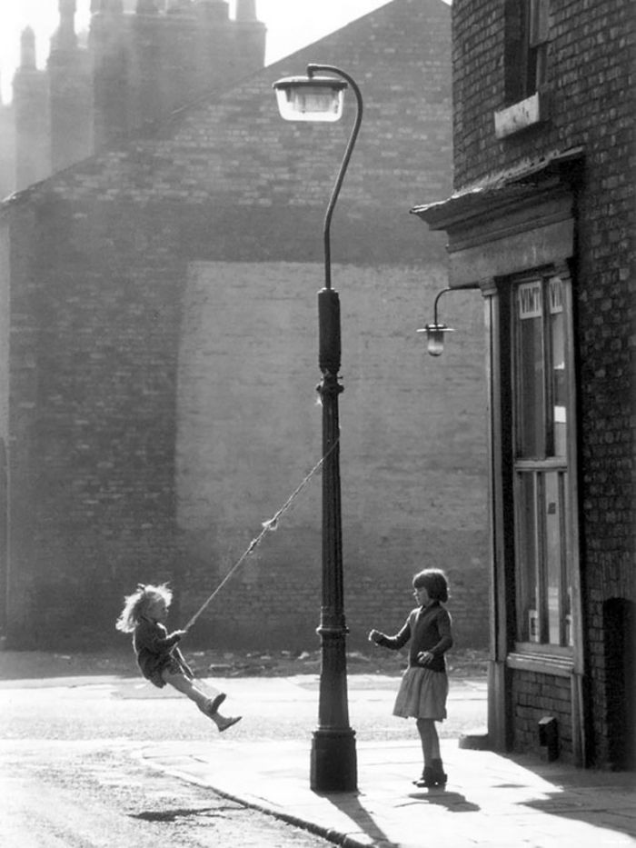 Two Girls Swing On A Lampost, Manchester, 1965