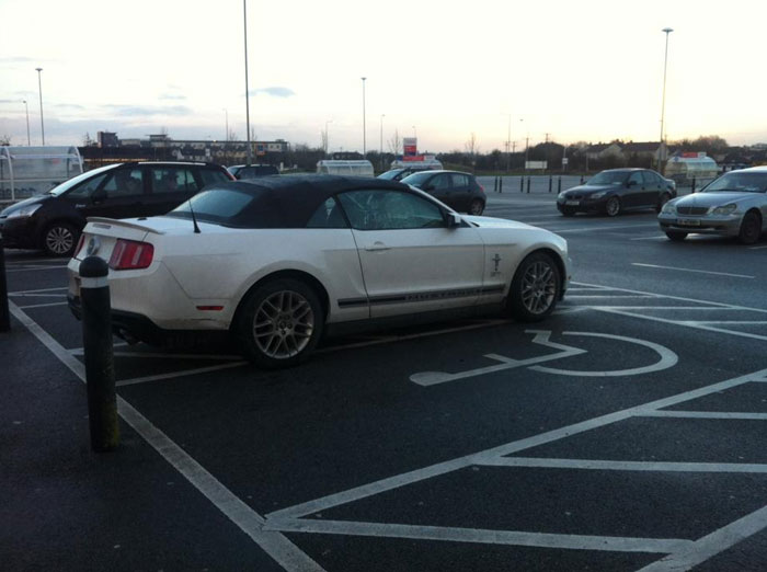 In A Nearly Empty Car Park, The Only Mustang In Ireland Taking Up Not Only One, But Two Disabled Parking Spots