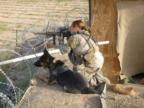 Erica Mcrell, 7th Security Forces Squadron Military Working Dog Trainer, With Her Colleague