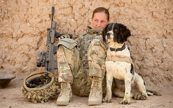 Cpl. Amy-Jane Harrop, A Military Working Dog Handler, Takes A Break In The Shade With Her Dog, Troy, In Afghanistan