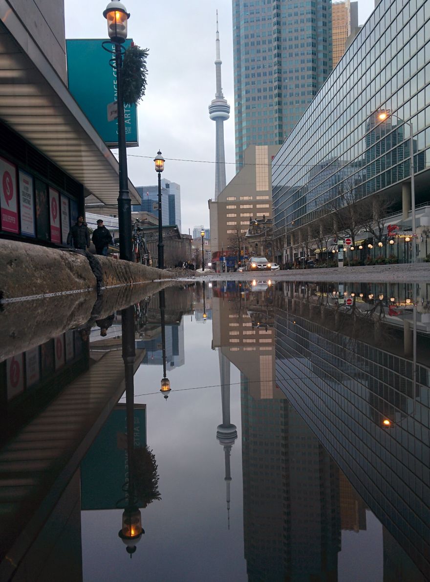 I Was Taking A Picture Of A Puddle In Toronto Until I Was Approched By Two Different Strangers And This Happened...