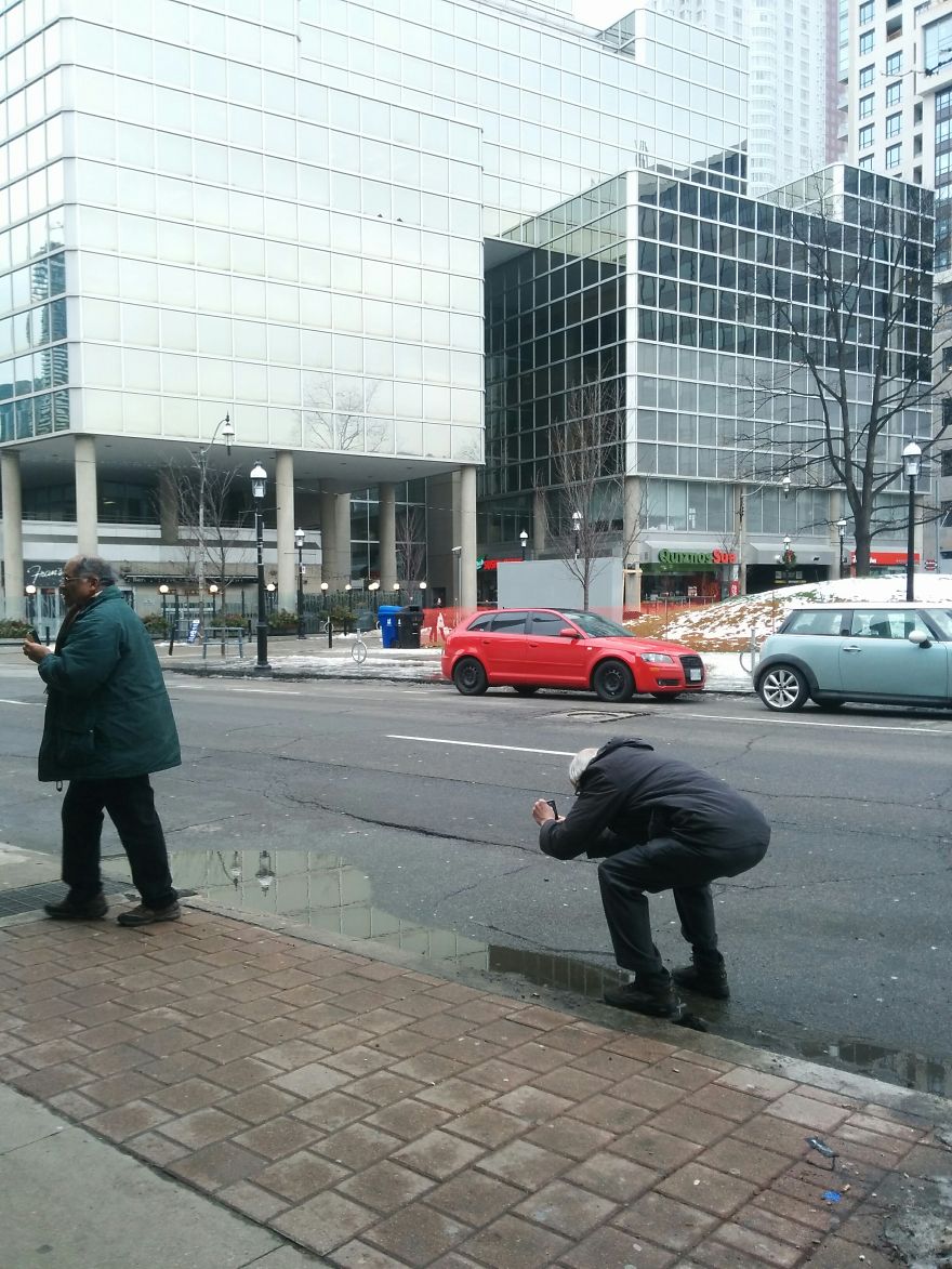 I Was Taking A Picture Of A Puddle In Toronto Until I Was Approched By Two Different Strangers And This Happened...
