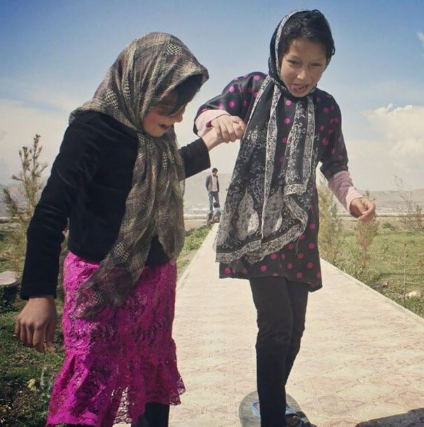 Two Girls Skateboarding For The First Time In Kabul