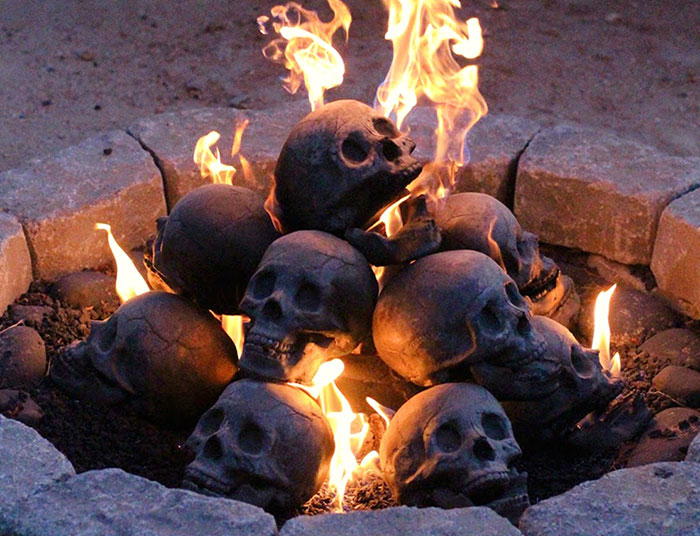 Terrifying Fireproof Human Skull Logs For Your Next Family Camping Trip