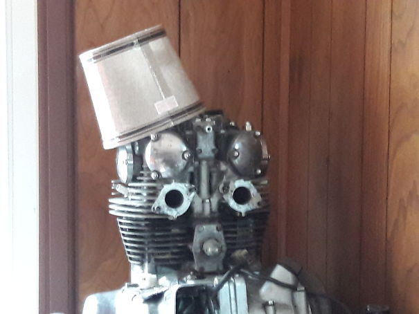 Motorcycle Engine Or Robot With A Hat?