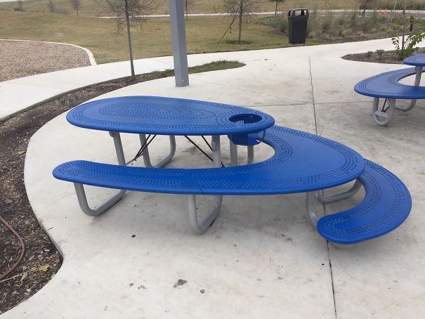 This Picnic Table Has Seating For Adults, Seating For Small Children, A High Chair And Space For Wheelchair Users