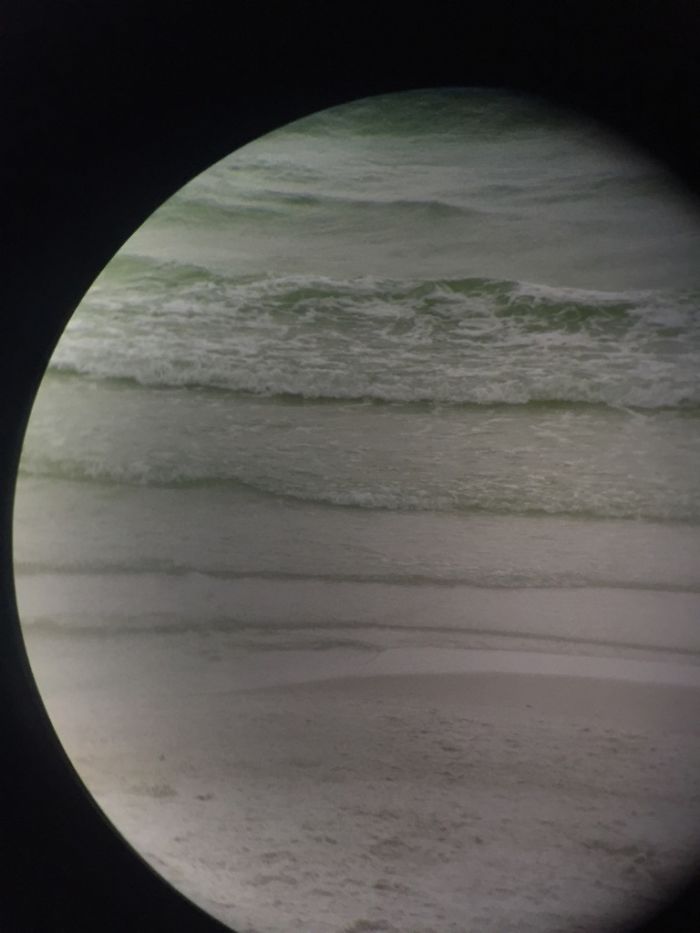 Took A Picture With My Phone Through Binoculars Of The Ocean And It Looks Like A Planet