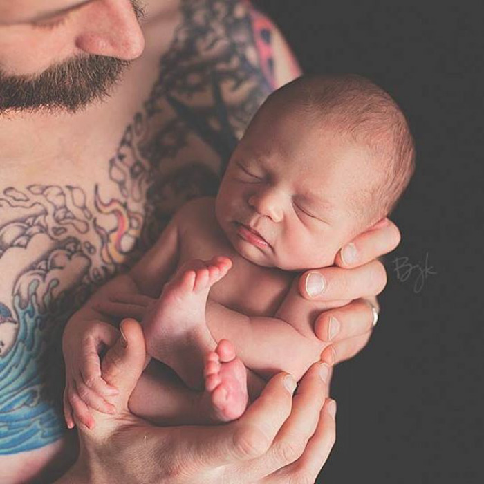 Baby Fits Perfectly In Her Daddy's Hands