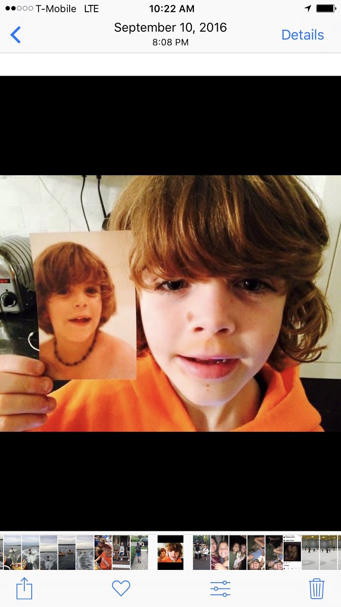 My Son Holding A Picture Of Me Both Age 9