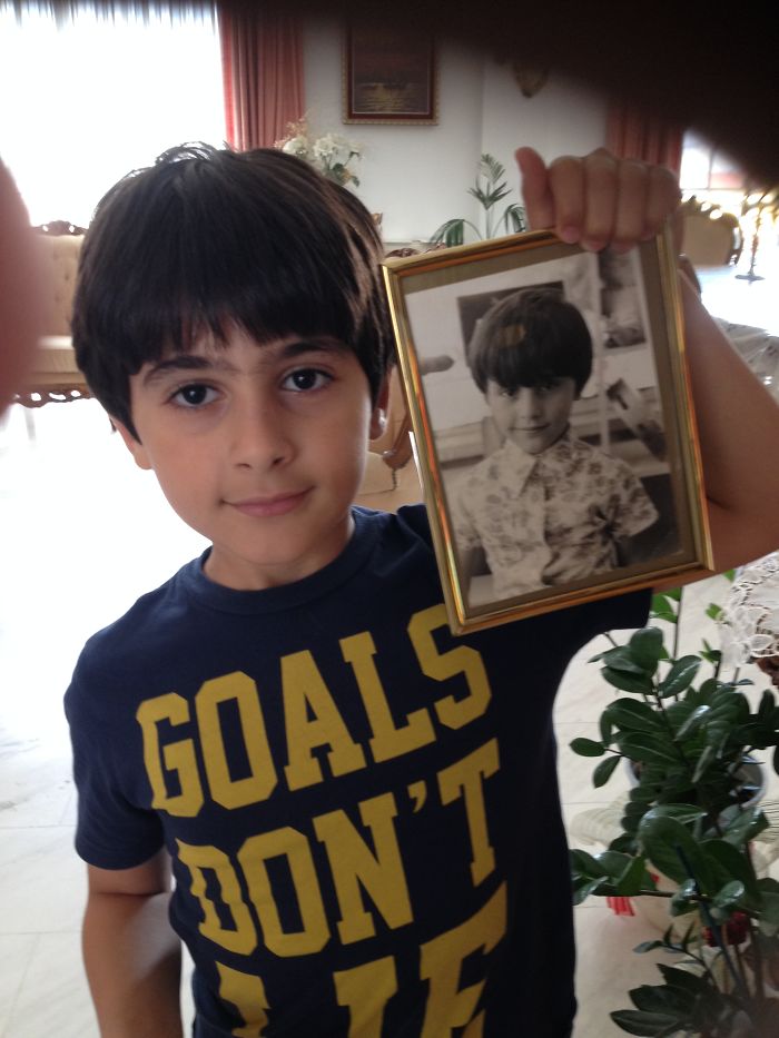 My Son Holding My Picture When I Was About His Age