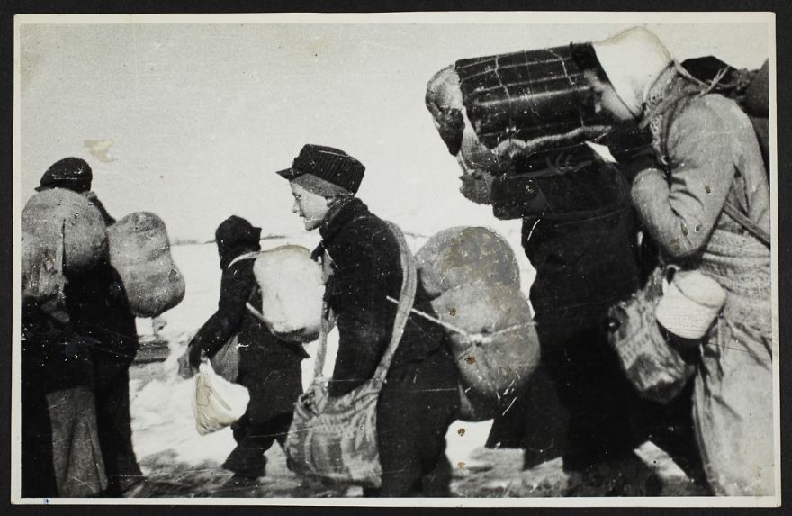 1944: A Boy Walks Among A Crowd Of People Being Deported In Winter