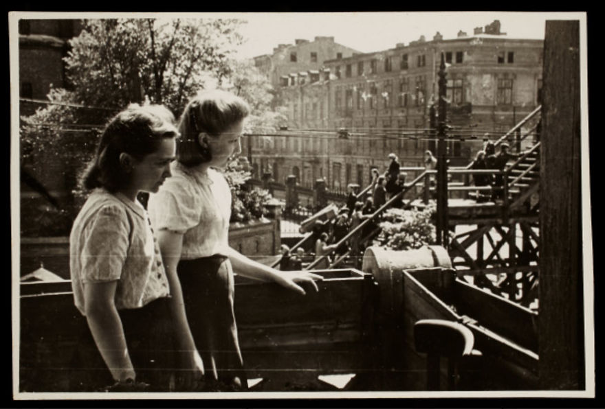 1940-1944: Two Young Women Observing The Bridge At Koscielyn Square, Crossing Zigerska Street