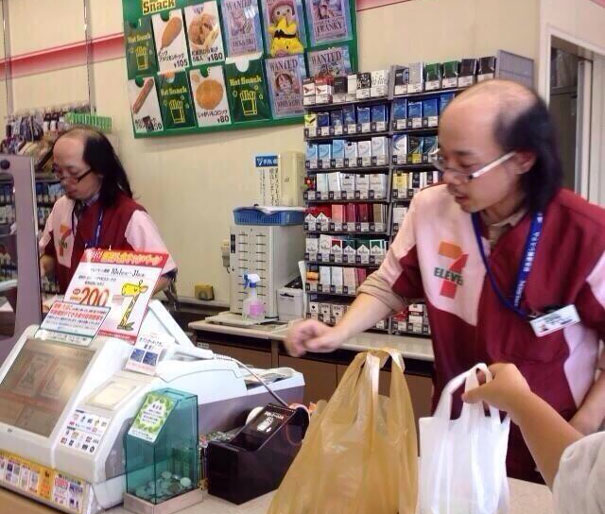 Two mans working at 7 Eleven and looking the same