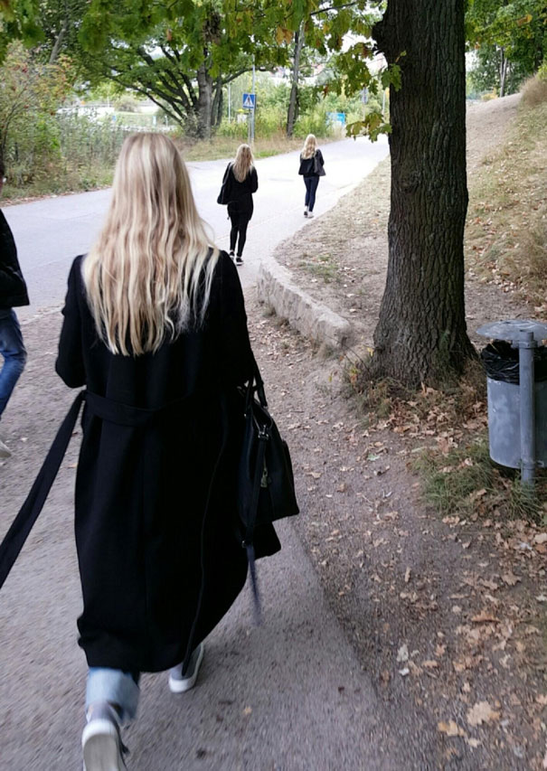 Three womans walking and wearing same clothes and having same long hairs
