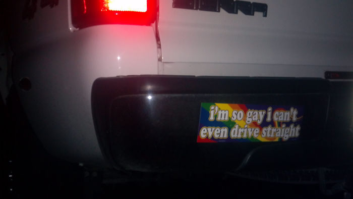 Bumper sticker with a humorous message about driving, highlighting epic revenge and karma themes on a white truck.