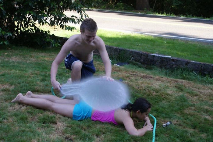 Balloon At The Exact Second It Explodes Over A Sunbathing Girl
