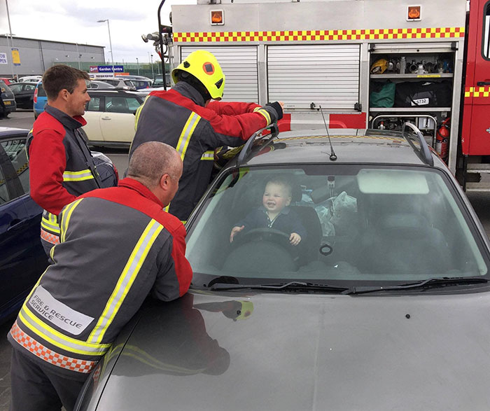 Toddler Can't Stop Laughing After Locking Himself In Car While 5 Firefighters Try To Rescue Him