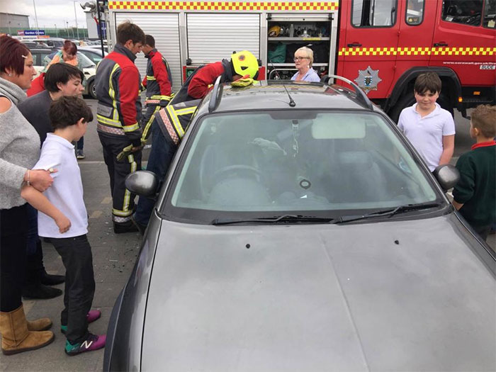 Toddler Can't Stop Laughing After Locking Himself In Car While 5 Firefighters Try To Rescue Him