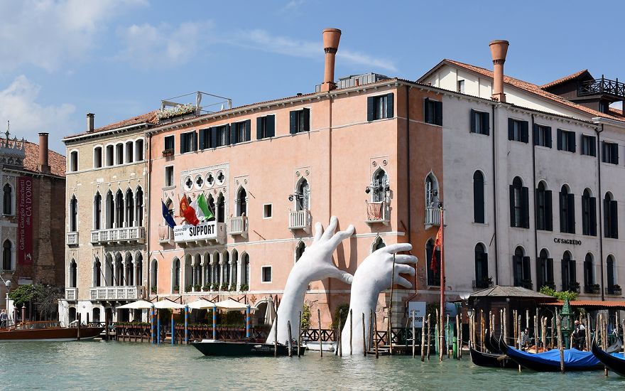 Support: Giant Hands Rise From A Canal In Venice To Send A Powerful Message About Climate Change