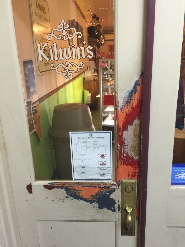 The Paint On This Chocolate Shop's Door Is Worn Away Perfectly To Reveal All Of Its Previous Colours