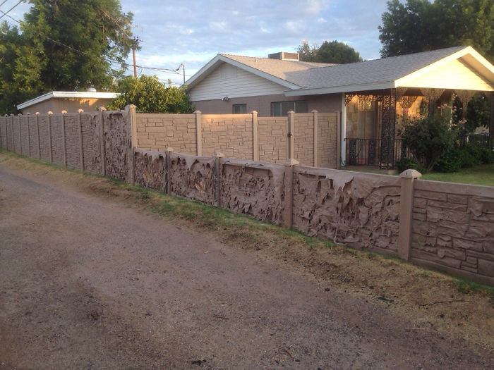 My Neighbors Put Up This Fake Rock Plastic Wall Over The Winter. It's Slowly Melting Away In The Heat