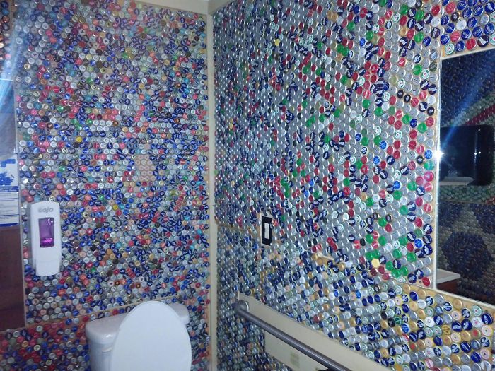 The Bathroom Walls In This Bar Are Decorated With Bottle Caps