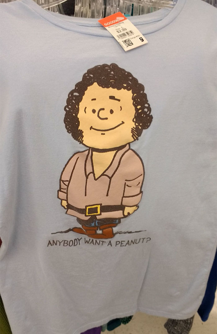 Graphic T-shirt with cartoon character found in thrift store, featuring "Anybody want a peanut?" text.