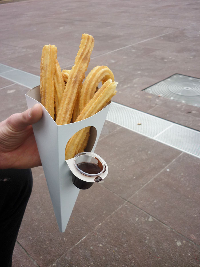 Churros With A Container For Chocolate Sauce