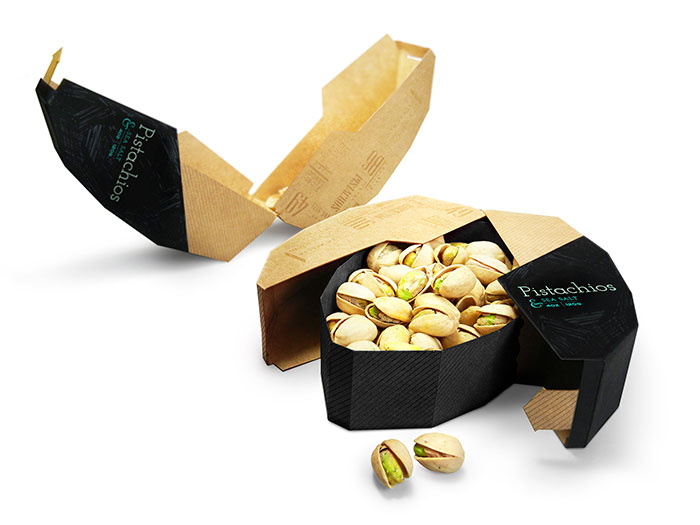 Packaging For Pistachio Nuts. Inside Tray Holds Pistachios But The Outer Part Separates And Becomes A Tray For The Shells